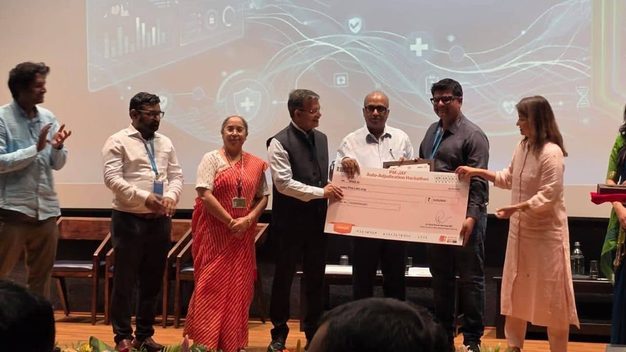 The BiltIQ AI team receiving the PM-JAY Auto-Adjudication Hackathon award on stage.